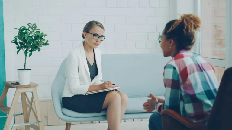 Two women talking in a therapy session